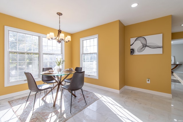 dining room with an inviting chandelier and a wealth of natural light