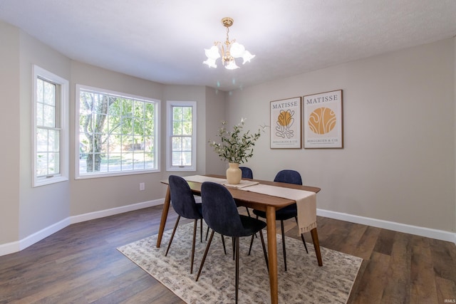 dining room featuring a chandelier and dark hardwood / wood-style flooring