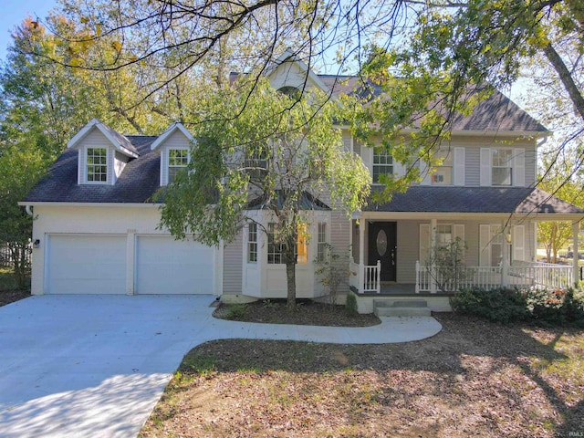 view of front of house featuring a garage and covered porch