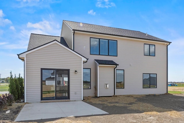 rear view of house with a patio