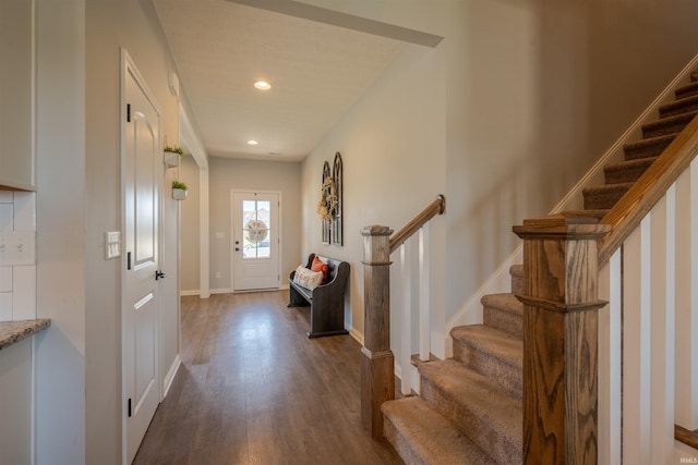 entryway with dark hardwood / wood-style flooring