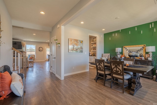 dining room with wood-type flooring