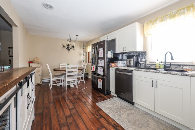 kitchen with sink, tasteful backsplash, dark wood-type flooring, white cabinetry, and appliances with stainless steel finishes