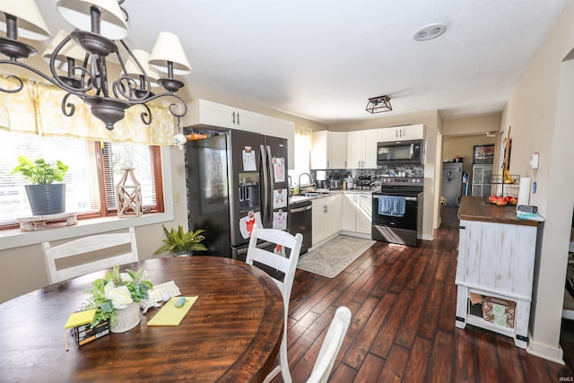 dining area featuring dark hardwood / wood-style floors and sink