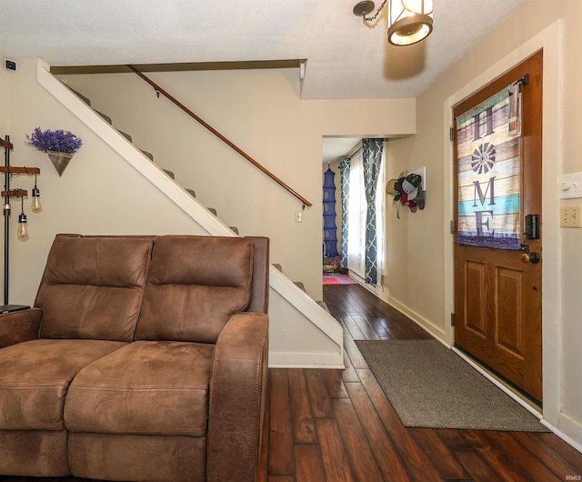 foyer with dark hardwood / wood-style flooring