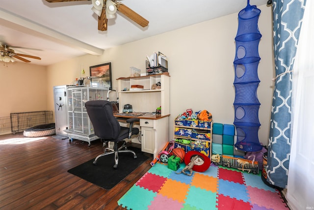 home office with ceiling fan, beamed ceiling, and dark wood-type flooring