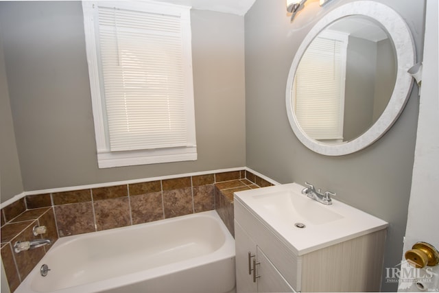 bathroom with a bathtub and vanity