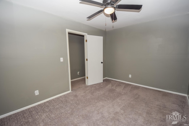 unfurnished bedroom featuring ceiling fan and carpet