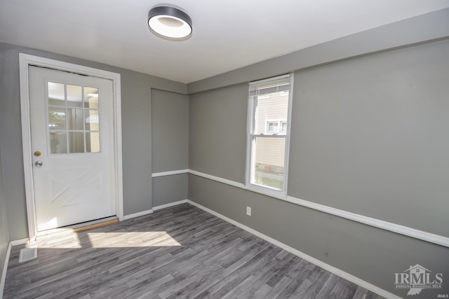 unfurnished room featuring hardwood / wood-style flooring