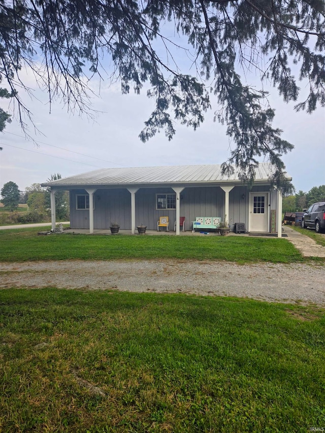 exterior space featuring a porch and a front yard