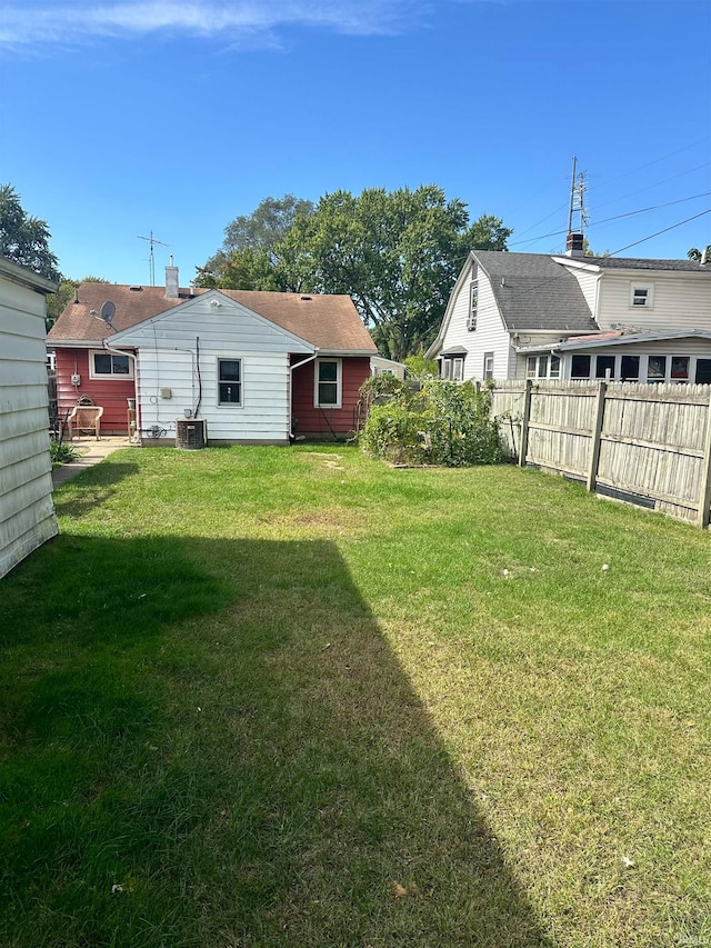 view of yard featuring central air condition unit