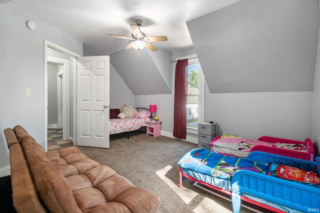 carpeted bedroom featuring lofted ceiling and ceiling fan