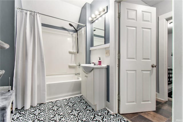 bathroom featuring hardwood / wood-style flooring, vanity, and shower / bath combination with curtain