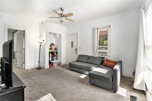 living room featuring ceiling fan and light colored carpet