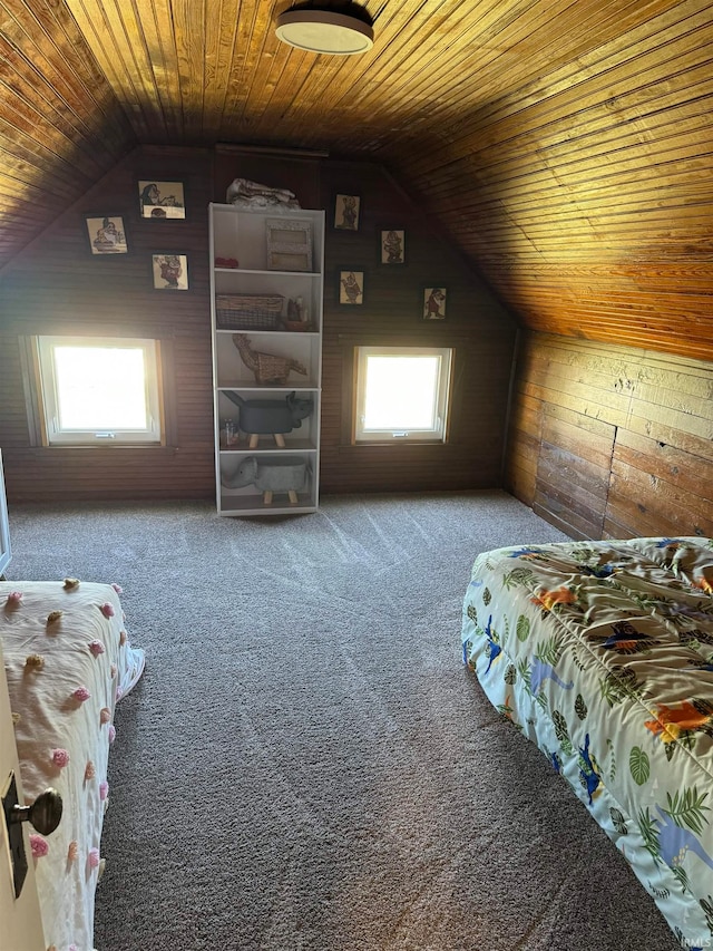 bedroom featuring wood ceiling, wood walls, vaulted ceiling, and multiple windows