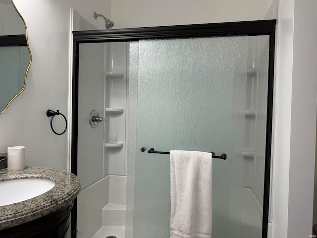 bathroom with vanity and an enclosed shower