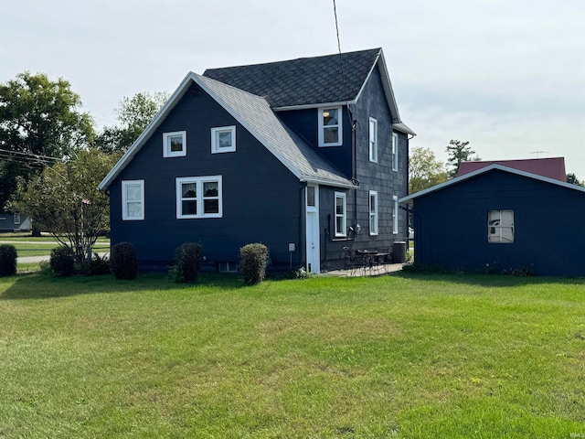 back of house featuring a yard