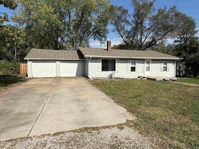 single story home with a front yard and a garage