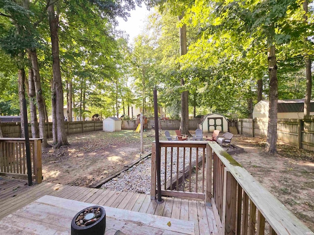 wooden deck featuring a storage shed