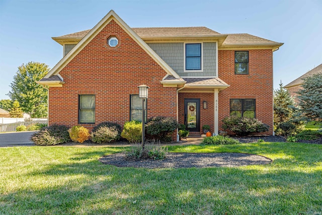 view of front facade featuring a front yard