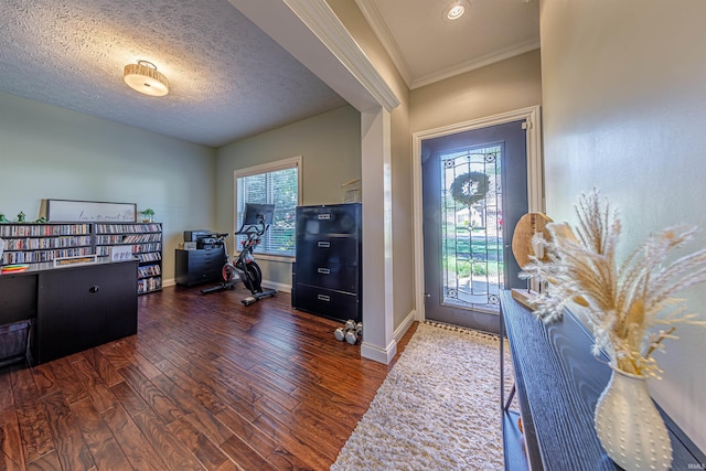 foyer with a textured ceiling, crown molding, and dark hardwood / wood-style flooring