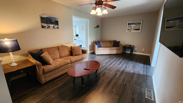 living room featuring ceiling fan and dark hardwood / wood-style flooring