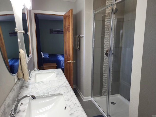 bathroom with walk in shower and vanity