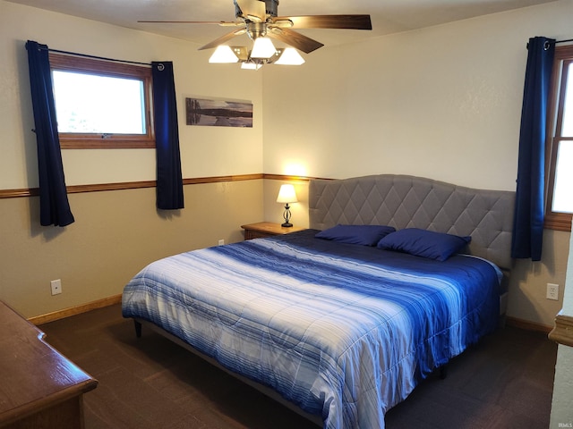 carpeted bedroom featuring ceiling fan