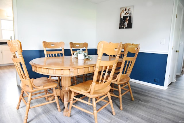 dining area with wood-type flooring