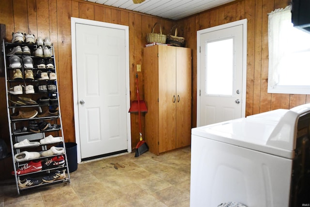 washroom with washer / clothes dryer, wood ceiling, and wood walls