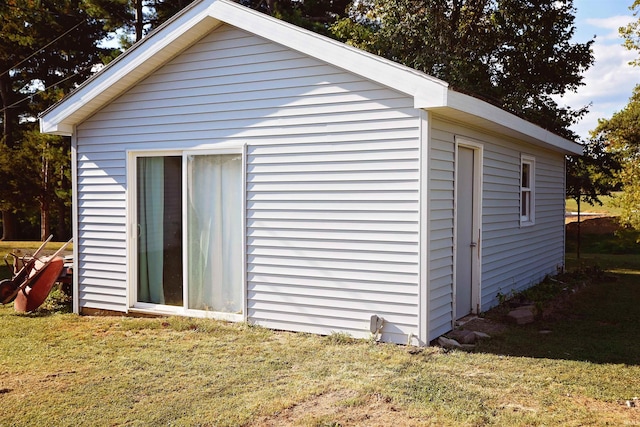 view of outdoor structure with a lawn