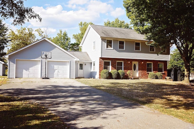 colonial inspired home featuring a garage