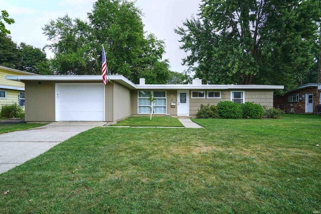 ranch-style home featuring a garage and a front lawn