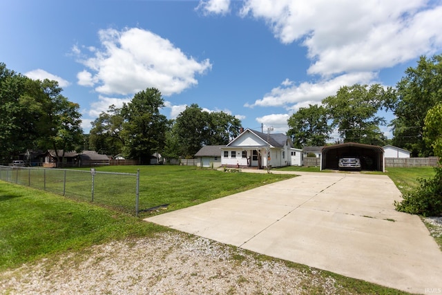 view of front of property with a front yard and a carport