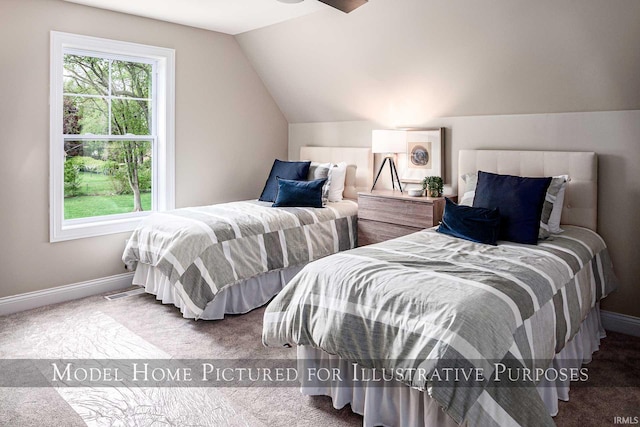 bedroom featuring lofted ceiling and carpet