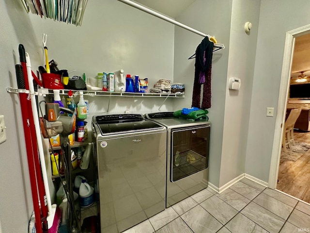 washroom featuring washer and clothes dryer and light hardwood / wood-style floors