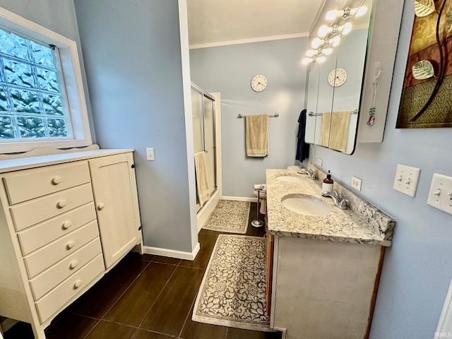 bathroom featuring hardwood / wood-style floors, a shower with door, vanity, and crown molding