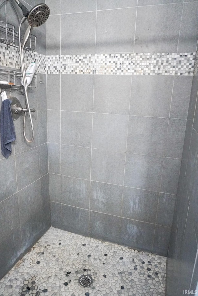 bathroom with tiled shower