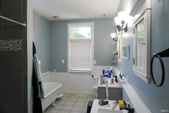 full bathroom with separate shower and tub, vanity, toilet, and tile patterned floors