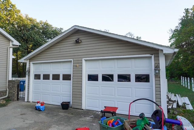 garage featuring wood walls