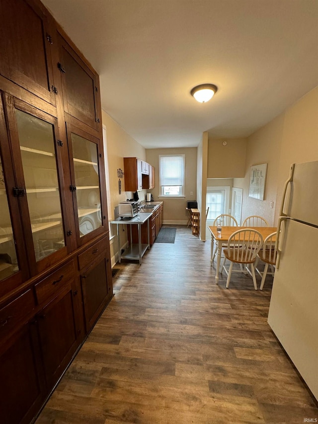 kitchen with dark wood-type flooring and white fridge