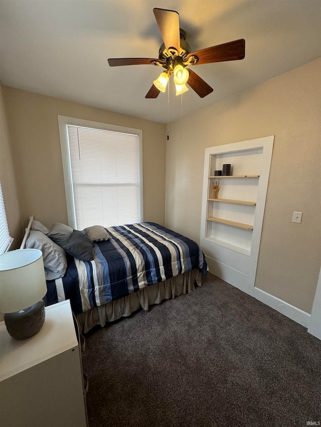 bedroom with ceiling fan and carpet flooring