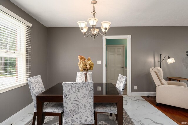 dining room featuring a notable chandelier