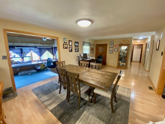 dining area with light hardwood / wood-style flooring