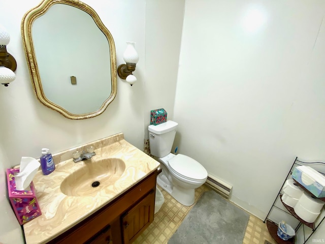 bathroom featuring a baseboard radiator, vanity, and toilet