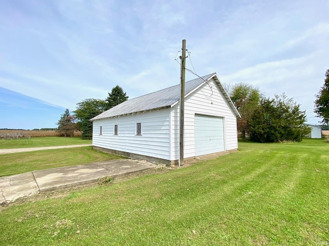 garage featuring a yard