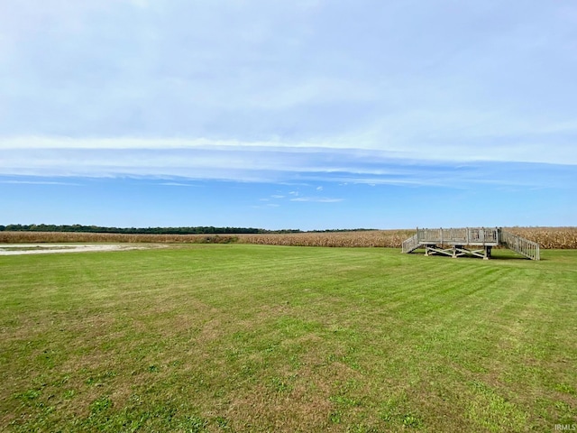 view of yard with a rural view