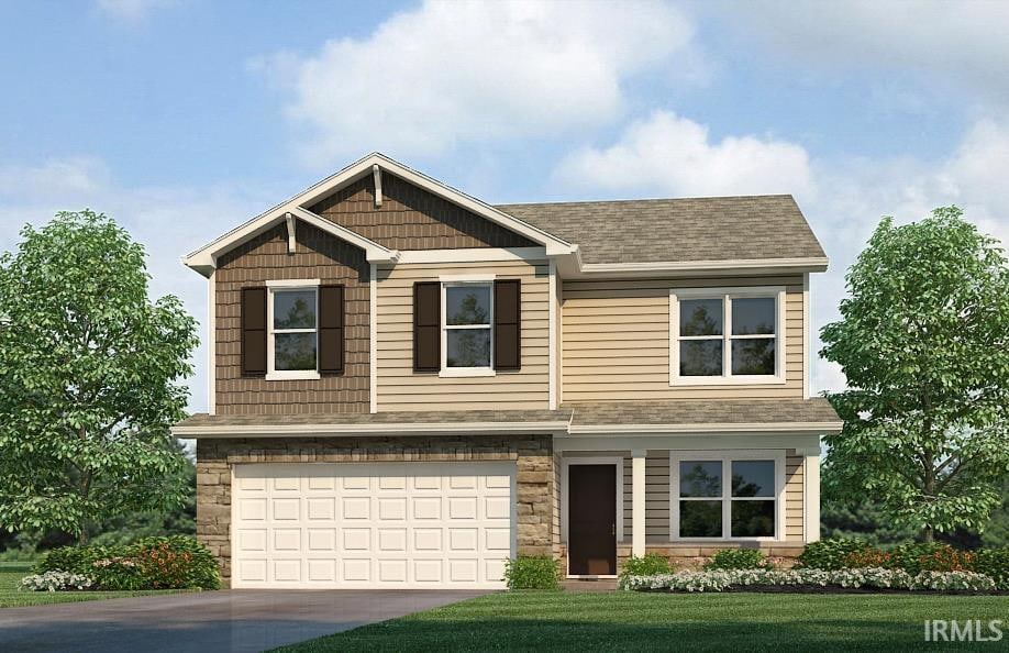 view of front facade with a front yard and a garage