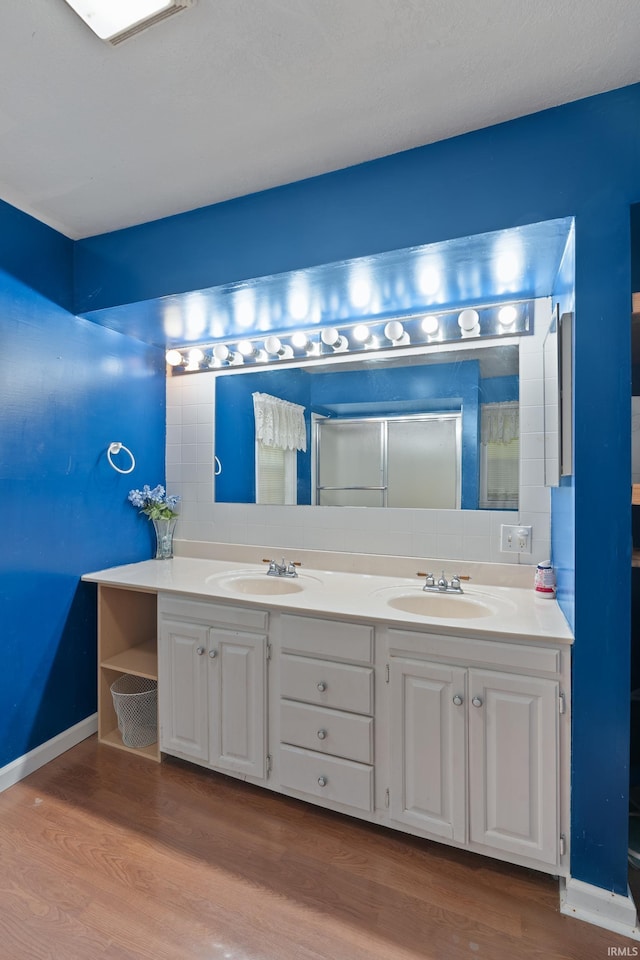 bathroom with vanity and hardwood / wood-style flooring