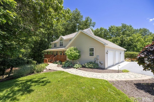 view of property exterior with a garage, a wooden deck, and a lawn